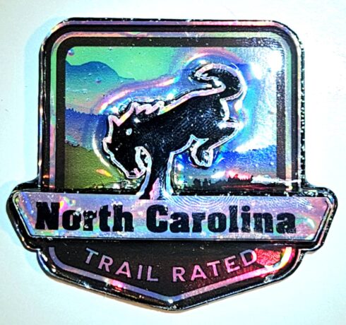 NC- Trail Rated Bronco Medallion -visual description