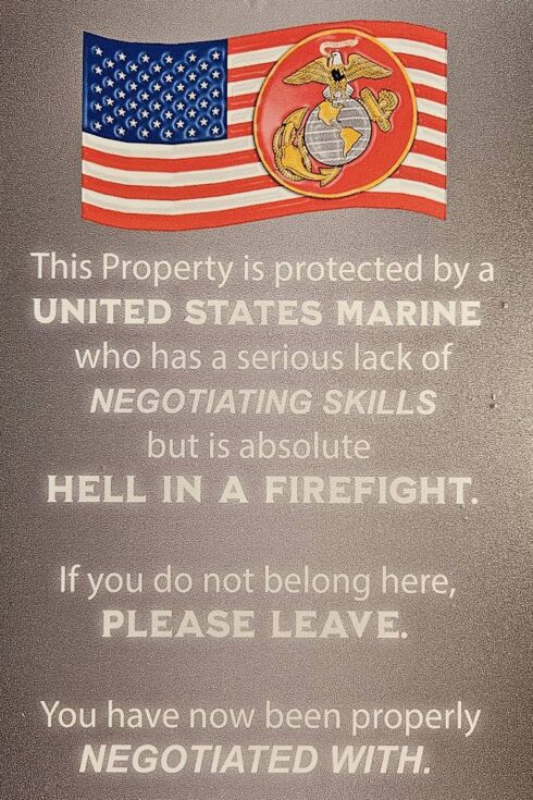 Marine-Negotiating-Firefight Garden Sign -visual description