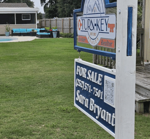 Carved Real Estate Sign -visual description