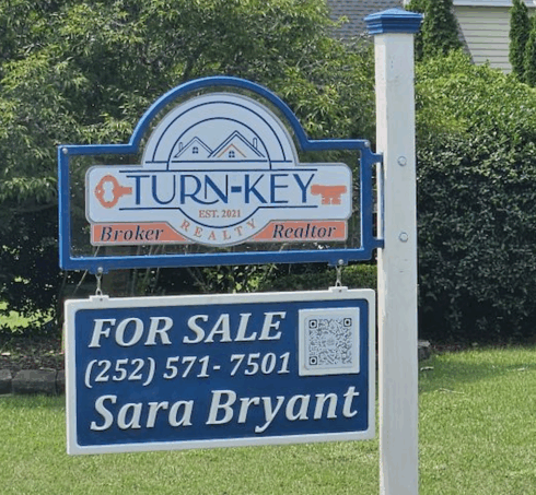 Carved Real Estate Sign -visual description